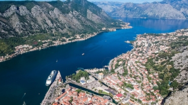 aerial view of city near body of water during daytime