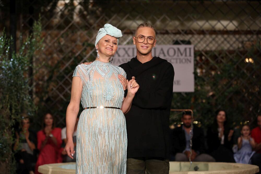 Lazar Ilic with a model on fashion show 